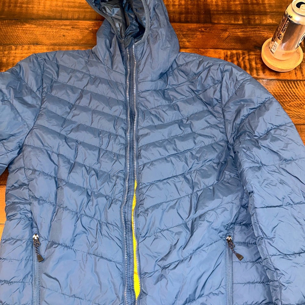 Men’s Champion puffer jacket size M. Color Navy. Yellow on inside but can’t see